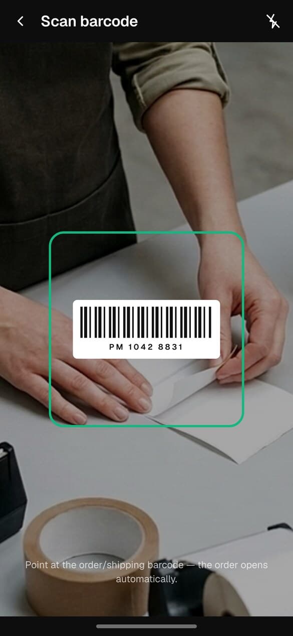 The barcode scanner in the app, with a shipping barcode inside the green frame.
